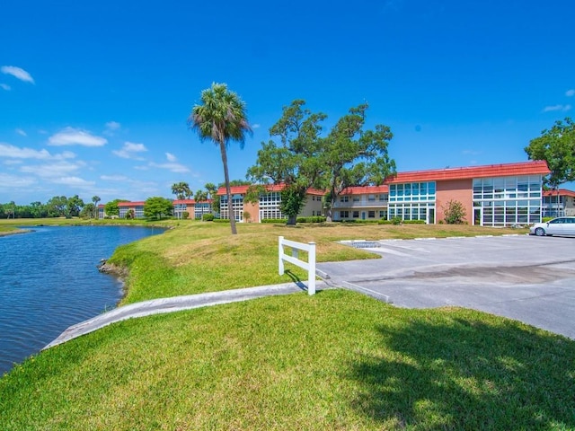 exterior space with a lawn and a water view