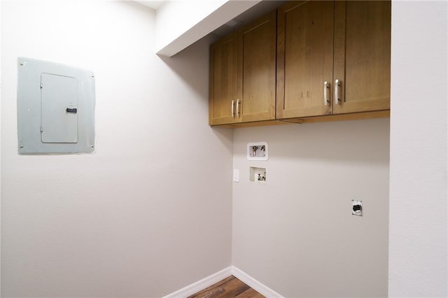 laundry room with baseboards, washer hookup, electric panel, cabinet space, and hookup for an electric dryer