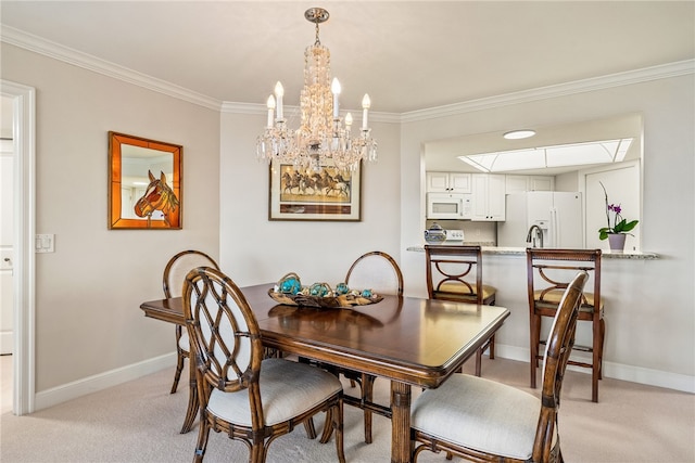 dining area featuring a notable chandelier, light colored carpet, and crown molding