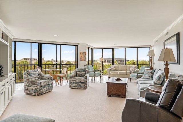 living room featuring floor to ceiling windows, crown molding, and plenty of natural light