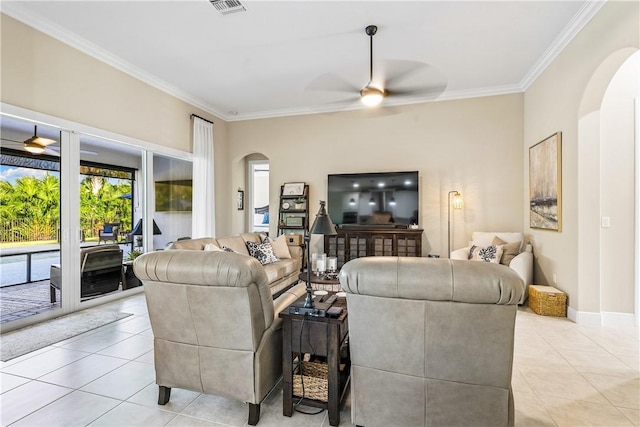 living room featuring ceiling fan, crown molding, and light tile patterned flooring