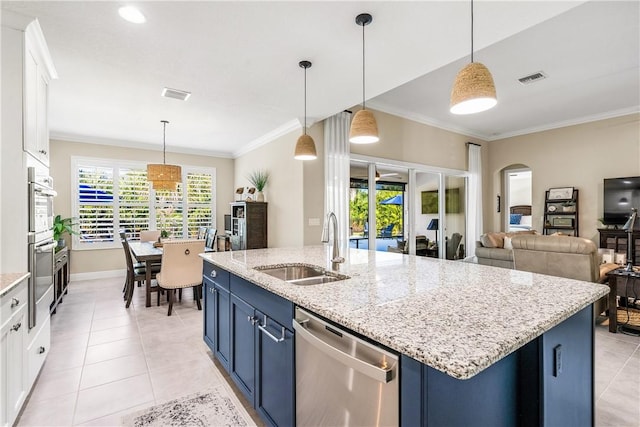 kitchen featuring pendant lighting, white cabinetry, blue cabinets, and appliances with stainless steel finishes