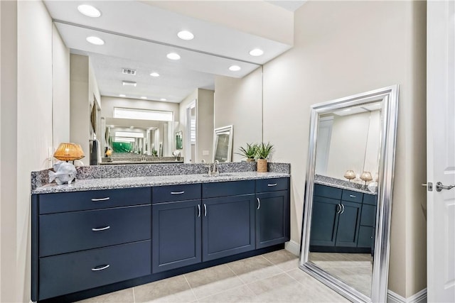 bathroom with tile patterned floors and vanity