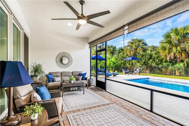 sunroom / solarium with ceiling fan