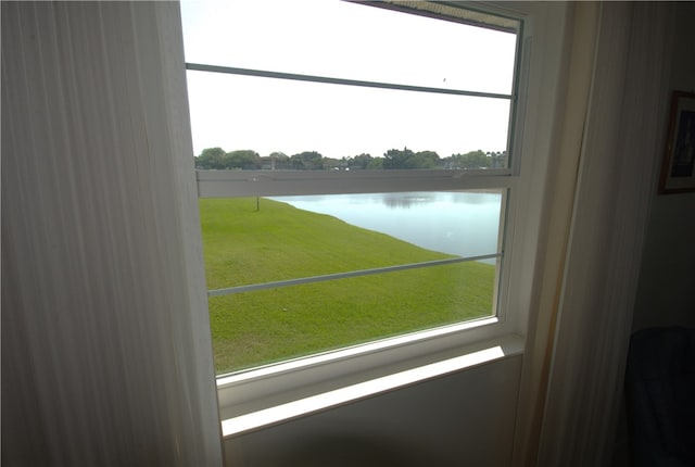 entryway with a water view and plenty of natural light