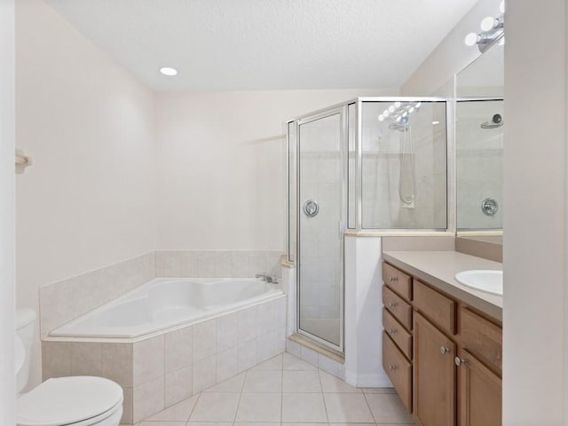 full bathroom with plus walk in shower, tile patterned flooring, vanity, and toilet