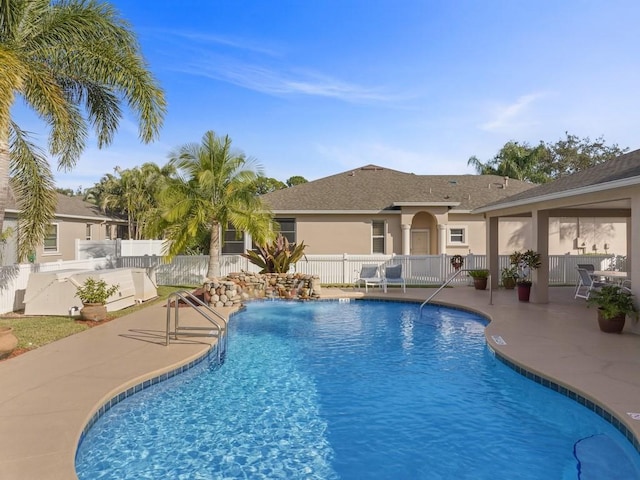 view of swimming pool with a patio area