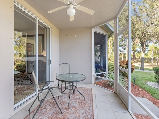 sunroom / solarium with ceiling fan