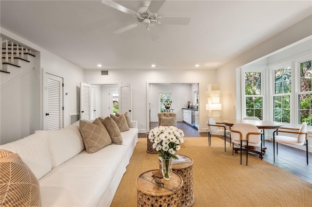 living area featuring recessed lighting, visible vents, and a wealth of natural light