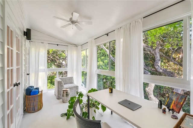 sunroom / solarium with a wealth of natural light, a ceiling fan, and lofted ceiling