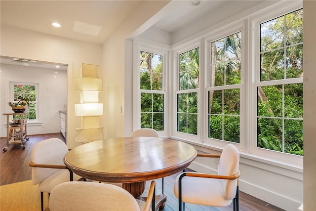 dining area with recessed lighting, baseboards, and wood finished floors