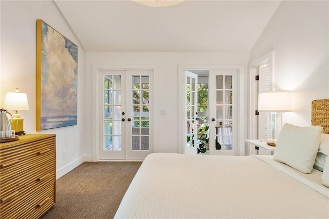 carpeted bedroom with french doors, multiple windows, lofted ceiling, and access to outside