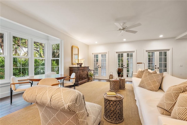 living area featuring a wealth of natural light, recessed lighting, french doors, and wood finished floors