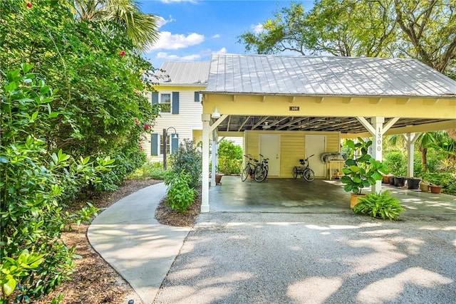 view of vehicle parking with a carport and driveway