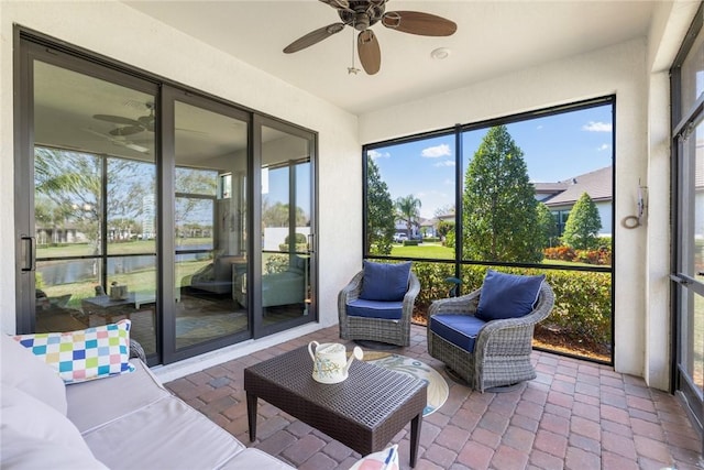 sunroom / solarium with ceiling fan