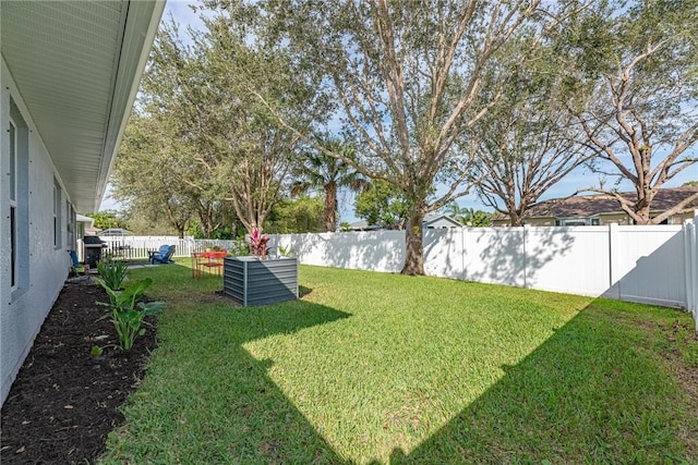 view of yard with a fenced backyard