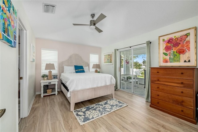 bedroom featuring a ceiling fan, access to outside, visible vents, and light wood finished floors