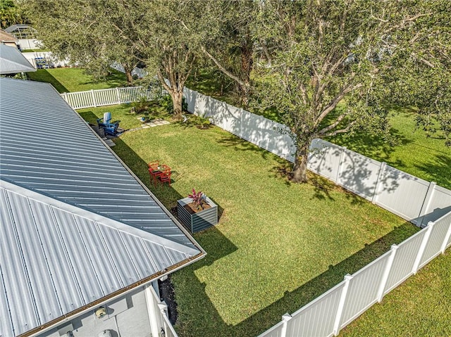 view of yard featuring a fenced backyard and central AC unit