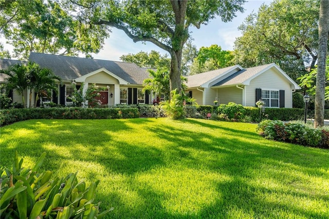 ranch-style home with a front yard