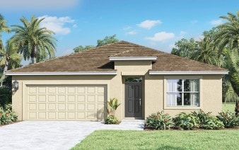 view of front facade with a garage, driveway, a front yard, and stucco siding