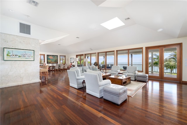 living room featuring french doors, high vaulted ceiling, a skylight, and dark hardwood / wood-style flooring