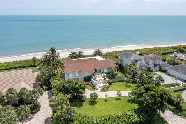 aerial view with a water view and a beach view