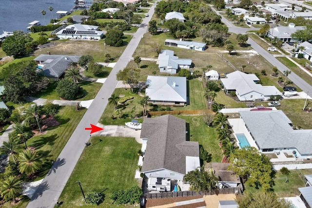 bird's eye view with a water view and a residential view