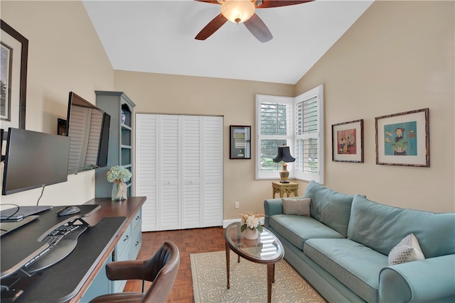 office space with dark parquet flooring, lofted ceiling, and ceiling fan