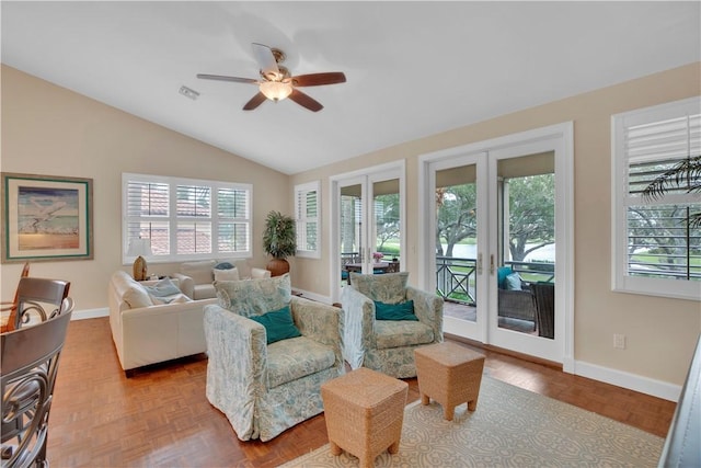 living room with vaulted ceiling, parquet flooring, ceiling fan, and french doors