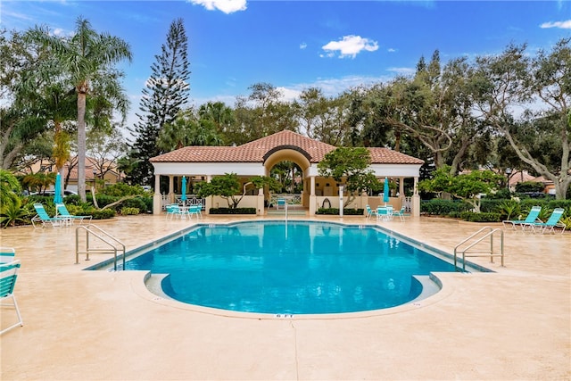 view of swimming pool featuring a patio