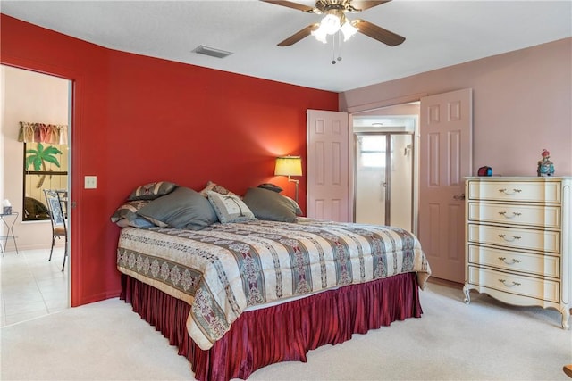 bedroom featuring ceiling fan and light colored carpet