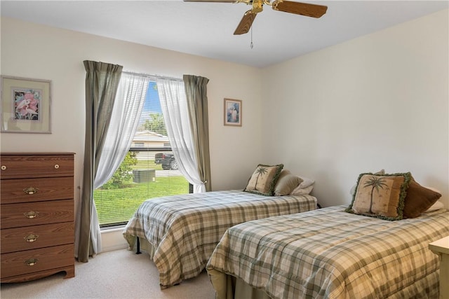 bedroom featuring ceiling fan and light colored carpet