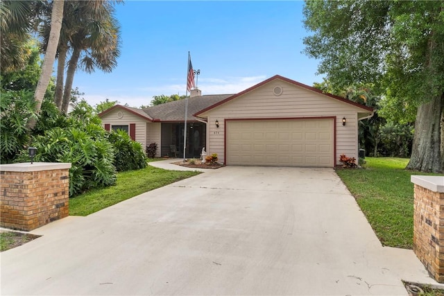 ranch-style home with a front lawn and a garage