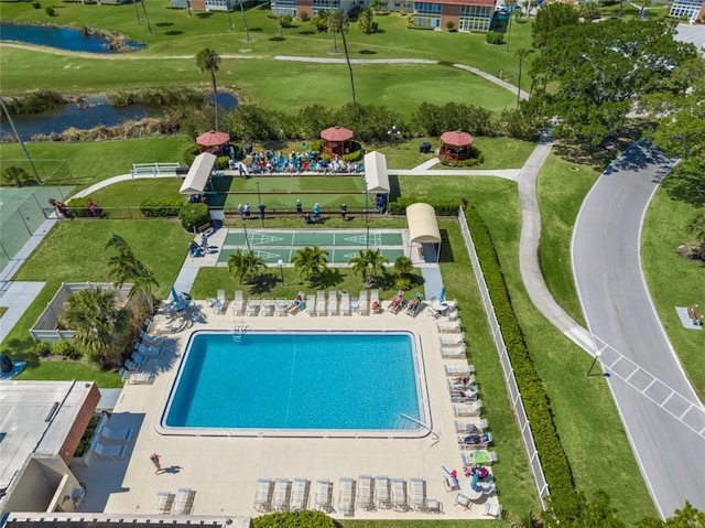 view of pool with a water view