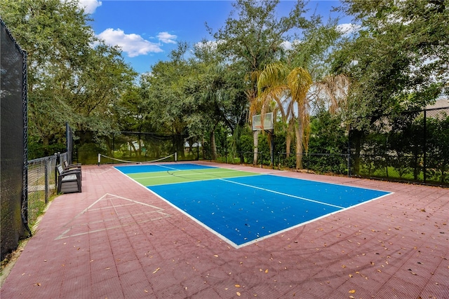 view of tennis court featuring basketball court