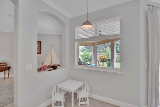 6770 49th Ct, Vero Beach, FL 32967 - dining room featuring ornamental molding, baseboards, and arched walkways