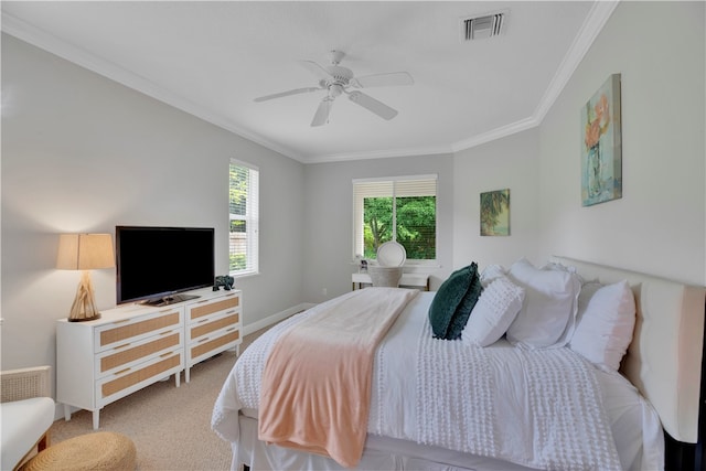 bedroom featuring carpet floors, ceiling fan, and crown molding