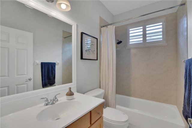 full bathroom with shower / tub combo with curtain, vanity, and toilet