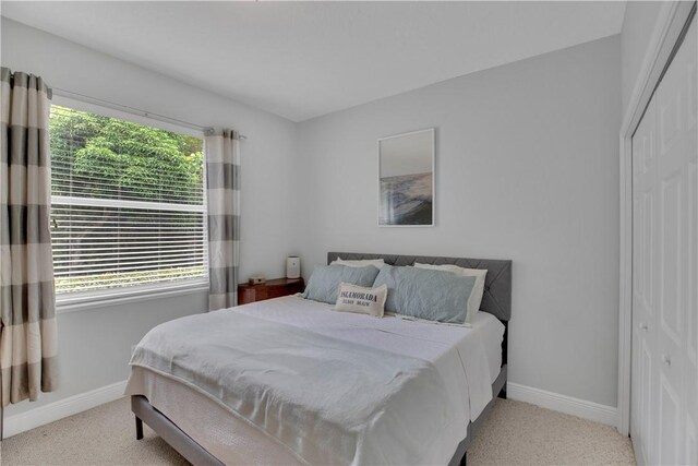 6770 49th Ct, Vero Beach, FL 32967 - carpeted bedroom with a closet and baseboards