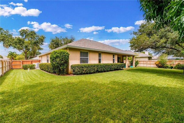 6770 49th Ct, Vero Beach, FL 32967 - rear view of house featuring stucco siding