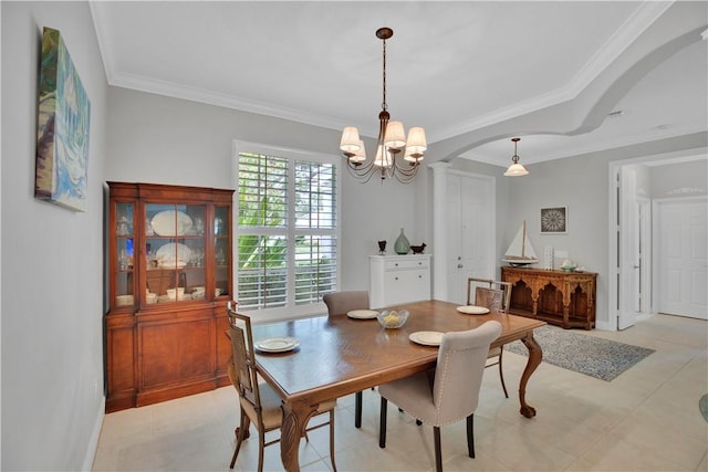 6770 49th Ct, Vero Beach, FL 32967 - dining area with arched walkways, ornamental molding, ornate columns, and a chandelier