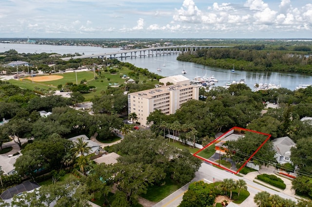 birds eye view of property with a water view