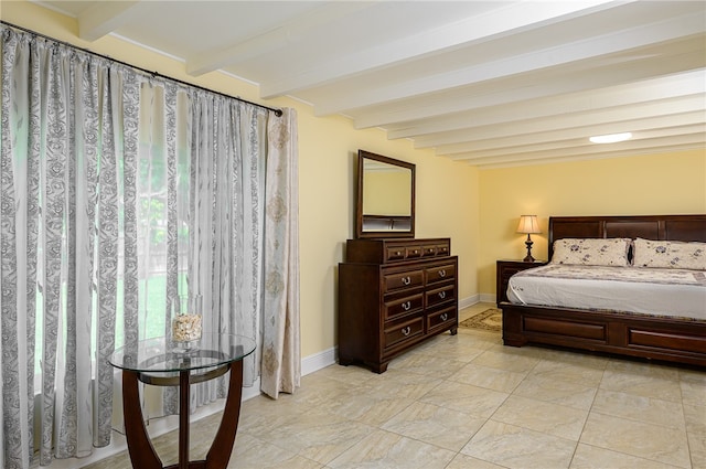 bedroom featuring beamed ceiling