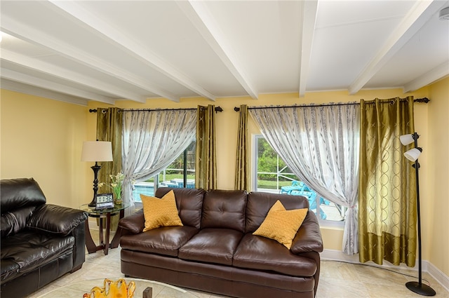 tiled living room featuring beam ceiling