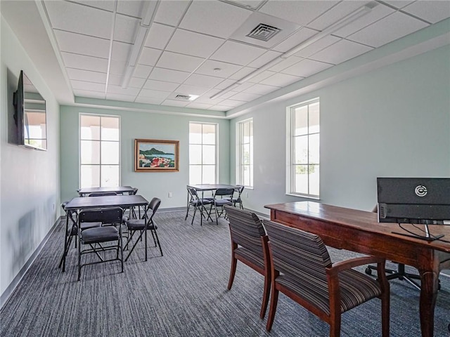 4101 Keeson Cir, Vero Beach, FL 32967 - dining room featuring dark carpet, healthy amount of natural light, and baseboards