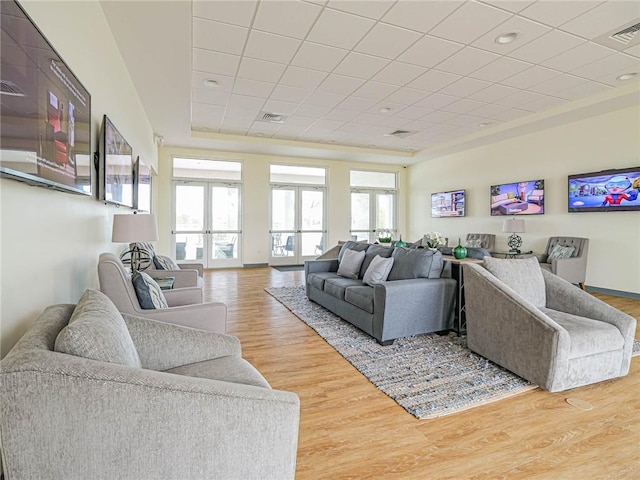 4101 Keeson Cir, Vero Beach, FL 32967 - living room with healthy amount of natural light, french doors, and wood finished floors