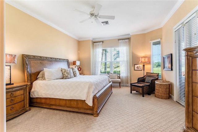 bedroom featuring light carpet, ornamental molding, and ceiling fan