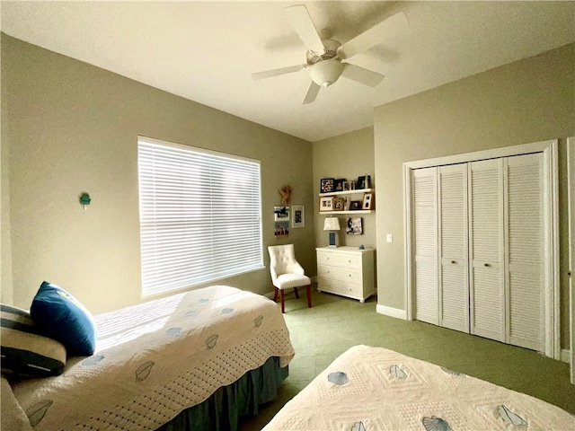 bedroom featuring lofted ceiling, ceiling fan, and a closet