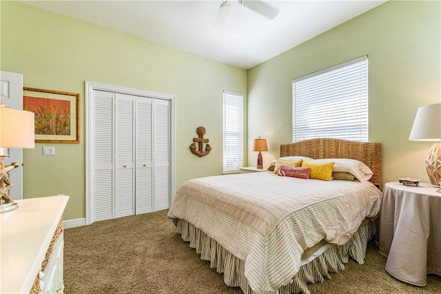 bedroom featuring ceiling fan, a closet, and carpet