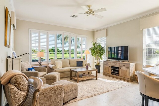 living room with crown molding, ceiling fan, and sink